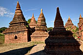 The cluster of red brick temples, named Khay-min-gha on the map on the North plain of Bagan. Myanmar. 